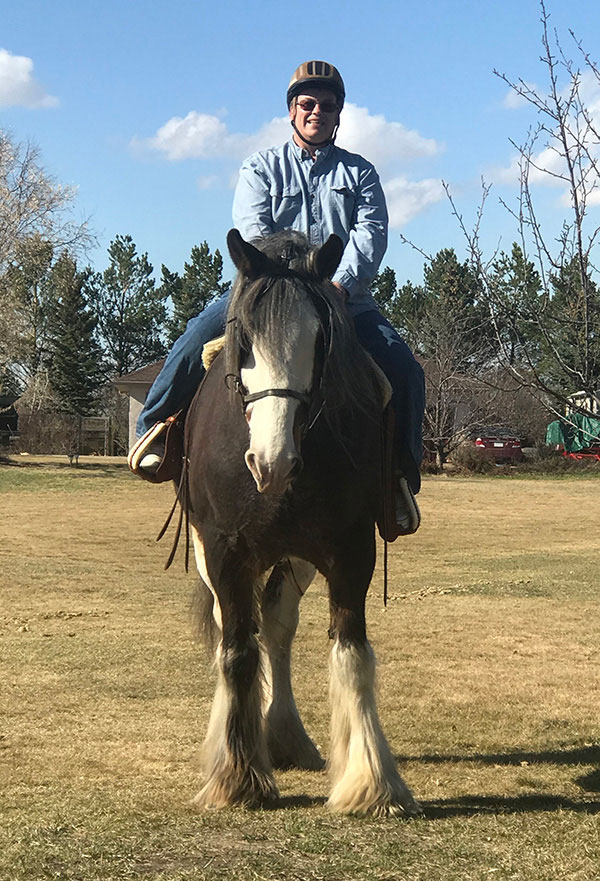 USask Vice-President of Finance and Resources Greg Fowler takes his horse Connor out for a ride on his acreage south of Saskatoon. (Photo: Submitted)